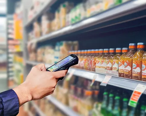 Seuic mobile computer scanning retail product barcodes for inventory management in grocery store